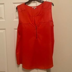 Sleeveless red zipper front blouse
